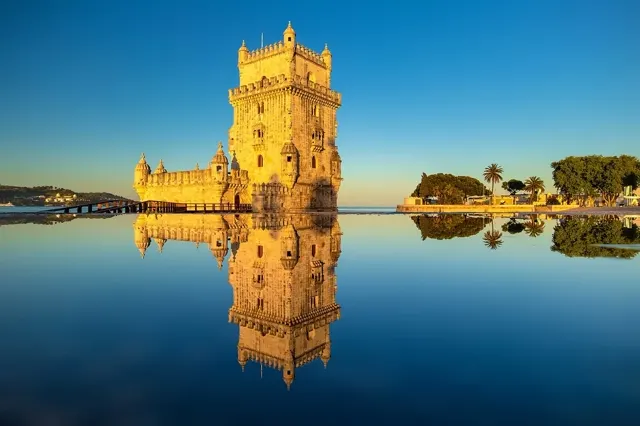Belém Tower reflected in the Tagus river at sunset